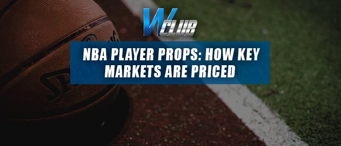 A basketball resting near the boundary line of an outdoor court, overlaid with the WClub logo and a blue banner reading "NBA PLAYER PROPS: HOW KEY MARKETS ARE PRICED".
